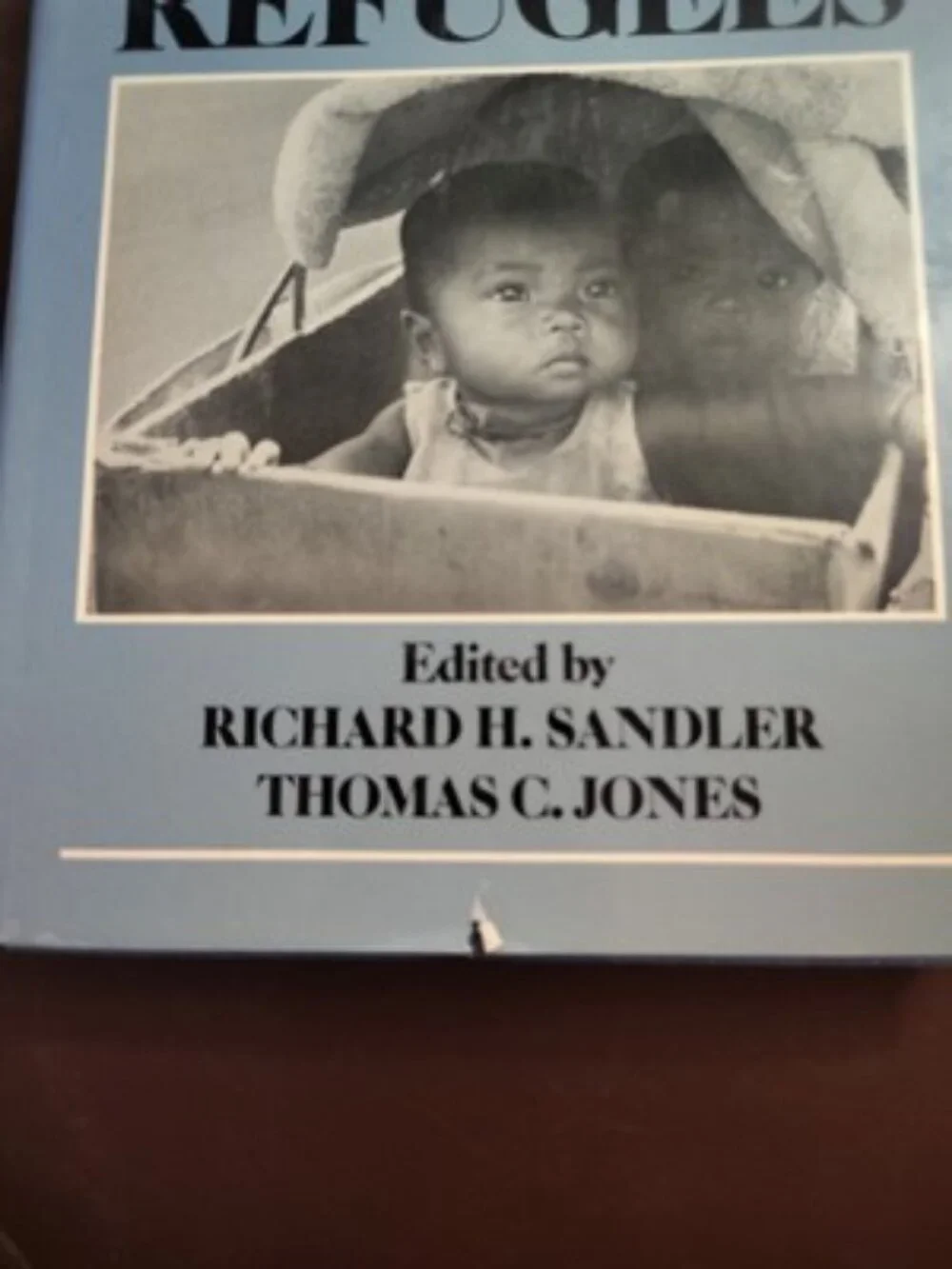 RICHARD H. SANDLER, MEDICAL CARE OF REFUGEES. HARDCOVER WJACKET. 019504181x